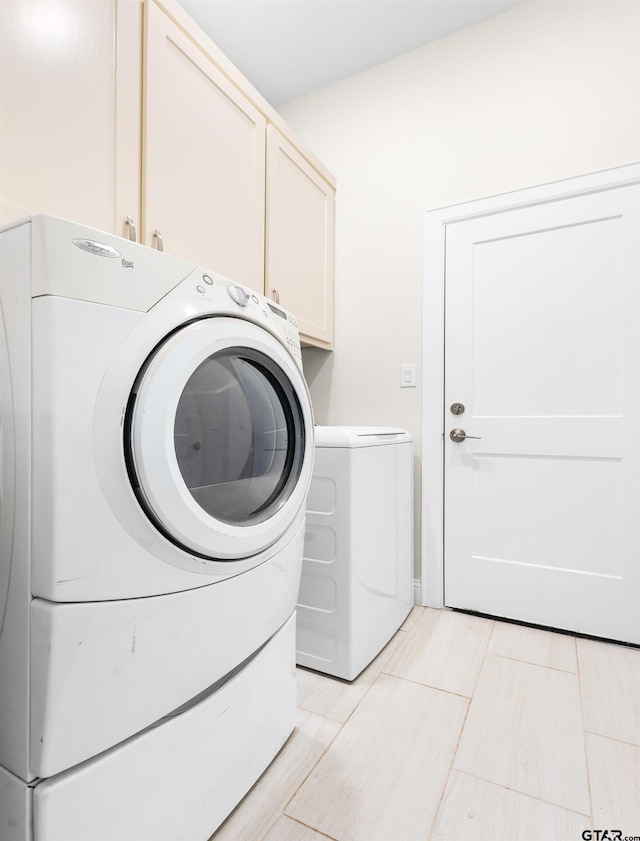 9109 Long Br, Tyler, TX 75703 - laundry area featuring cabinet space and independent washer and dryer