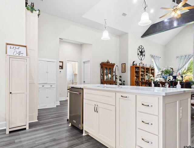 9109 Long Br, Tyler, TX 75703 - kitchen featuring dark wood-style floors, white cabinets, pendant lighting, stainless steel dishwasher, and high vaulted ceiling