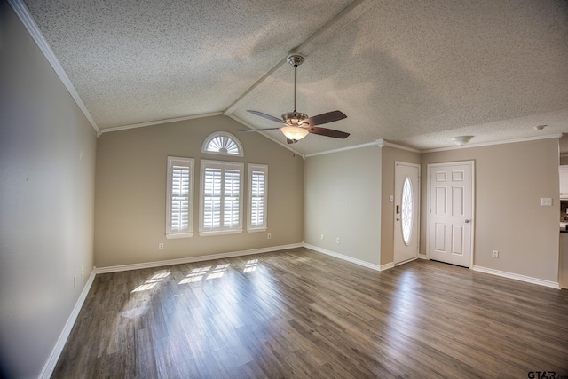 unfurnished living room featuring dark wood-type flooring, ornamental molding, vaulted ceiling, and a textured ceiling