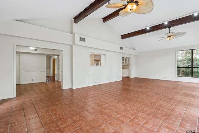 725 Purdue Dr, Tyler, TX 75701 - unfurnished living room with a ceiling fan, beam ceiling, light tile patterned floors, and high vaulted ceiling