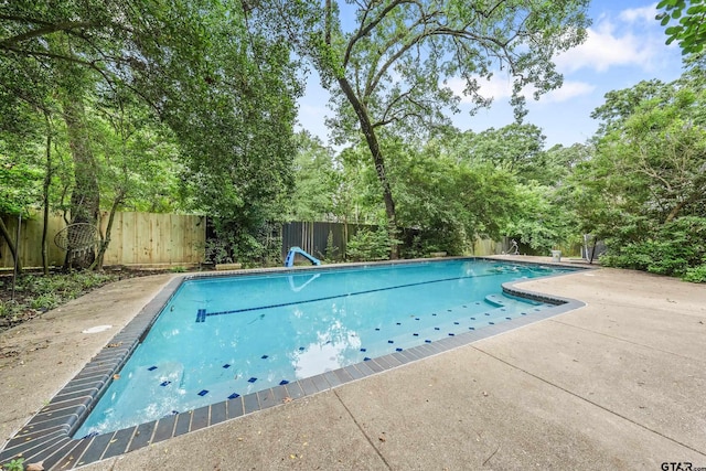 725 Purdue Dr, Tyler, TX 75701 - view of pool featuring a fenced backyard, a patio area, and view of scattered trees