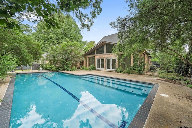 725 Purdue Dr, Tyler, TX 75701 - swimming pool featuring french doors