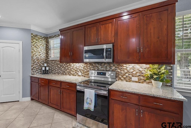 5900 Fm 858, Ben Wheeler, TX 75754 - kitchen with appliances with stainless steel finishes, backsplash, light stone countertops, ornamental molding, and light tile patterned floors