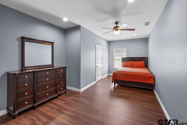 5900 Fm 858, Ben Wheeler, TX 75754 - bedroom with baseboards, dark wood finished floors, a textured wall, and ceiling fan
