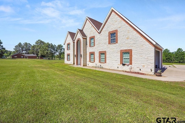 5900 Fm 858, Ben Wheeler, TX 75754 - view of front facade with stone siding, a front lawn, a garage, and concrete driveway