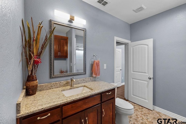 5900 Fm 858, Ben Wheeler, TX 75754 - bathroom with vanity, toilet, and baseboards