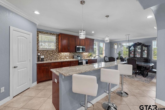 5900 Fm 858, Ben Wheeler, TX 75754 - kitchen featuring appliances with stainless steel finishes, light tile patterned flooring, backsplash, decorative light fixtures, and crown molding
