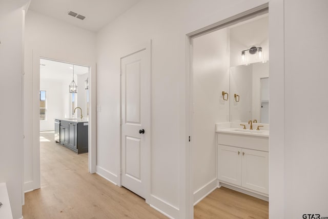 bathroom featuring hardwood / wood-style flooring and vanity