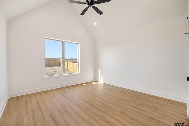 unfurnished room featuring light wood-type flooring, ceiling fan, and high vaulted ceiling