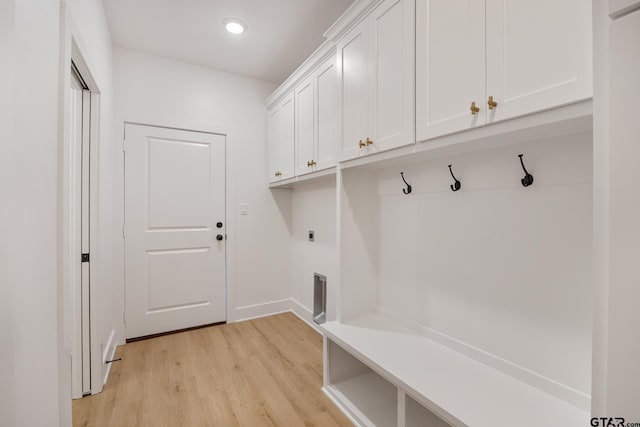 mudroom with light hardwood / wood-style floors