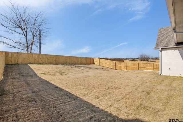 rear view of property with a lawn