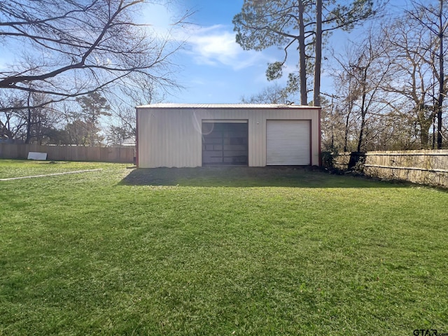 garage featuring a lawn