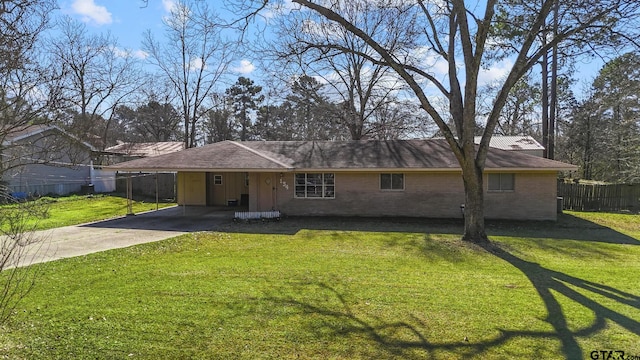 ranch-style home with a carport and a front yard