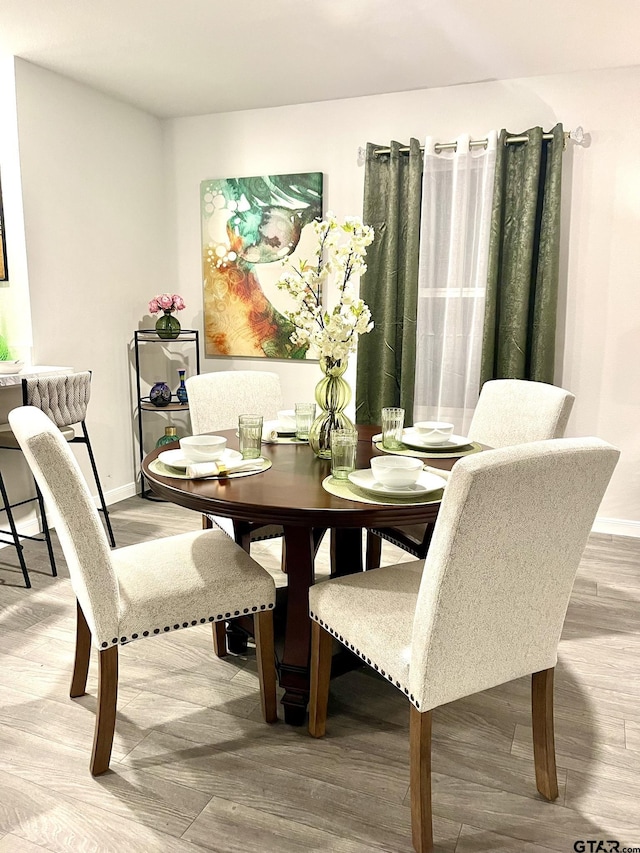 202 Parker Oaks, Chandler, TX 75758 - dining room featuring wood finished floors and baseboards