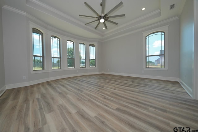 93 S Ryder Cup, Hideaway, TX 75771 - empty room with a tray ceiling, ornamental molding, ceiling fan, and light wood-type flooring