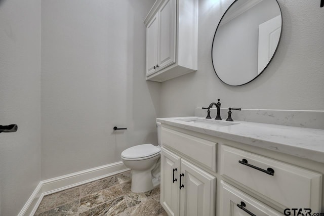 93 S Ryder Cup, Hideaway, TX 75771 - half bath with baseboards, stone finish floor, vanity, and toilet