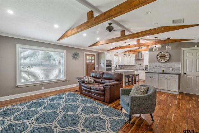 living room with recessed lighting, wood finished floors, baseboards, and lofted ceiling with beams