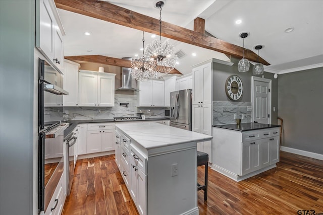kitchen with wall chimney range hood, decorative backsplash, vaulted ceiling with beams, stainless steel appliances, and dark wood-style flooring