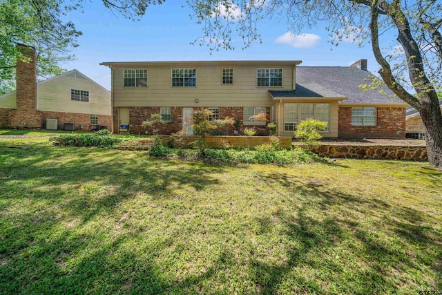 2110 Macbeth Ct, Tyler, TX 75703 - view of front of property featuring brick siding, central AC unit, and a front lawn