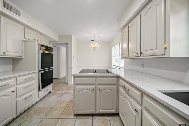 2110 Macbeth Ct, Tyler, TX 75703 - kitchen featuring visible vents, a peninsula, stainless steel double oven, black electric cooktop, and tasteful backsplash
