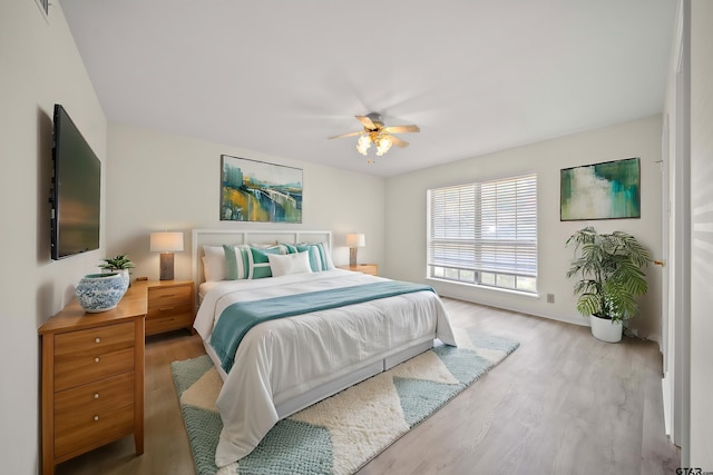 2110 Macbeth Ct, Tyler, TX 75703 - bedroom with baseboards, a ceiling fan, and wood finished floors