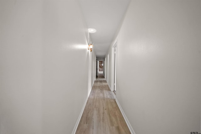 2110 Macbeth Ct, Tyler, TX 75703 - corridor featuring baseboards and light wood finished floors