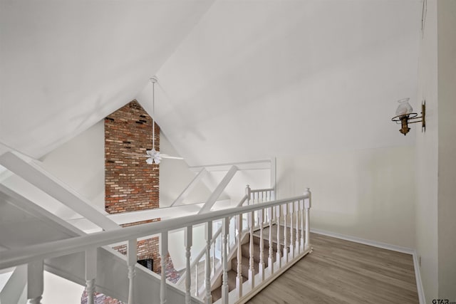 2110 Macbeth Ct, Tyler, TX 75703 - stairway featuring baseboards, vaulted ceiling, and wood finished floors