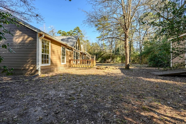 view of yard with a wooden deck