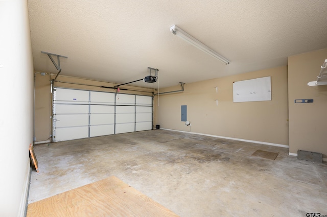 garage with a garage door opener and electric panel