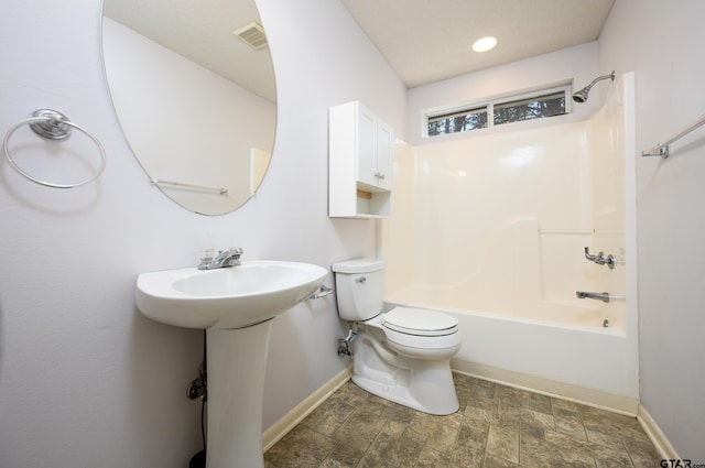 full bathroom with tub / shower combination, sink, and toilet