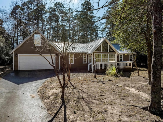 view of front of property with a garage and covered porch