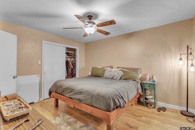 2617 Florence St, Kilgore, TX 75662 - bedroom with wood finished floors, baseboards, a closet, and a ceiling fan