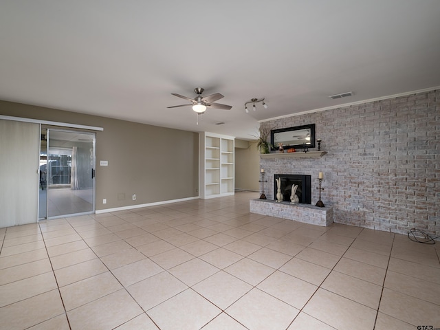 unfurnished living room featuring visible vents, ceiling fan, light tile patterned flooring, and a brick fireplace
