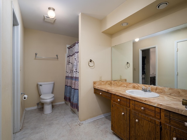 bathroom with vanity, baseboards, tile patterned floors, toilet, and visible vents