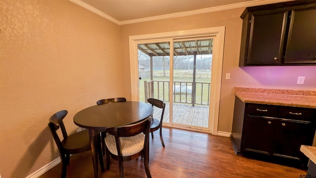 dining room featuring crown molding and light wood-type flooring