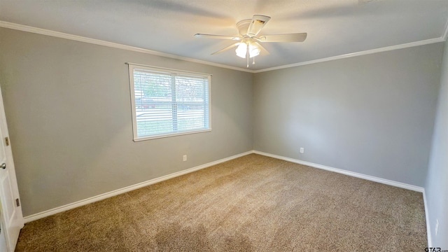 carpeted empty room with ornamental molding and ceiling fan