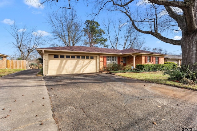 ranch-style home featuring a garage