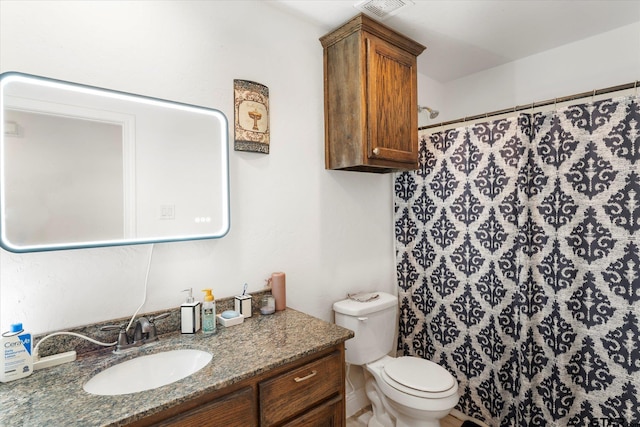 bathroom with vanity, toilet, and a shower with shower curtain