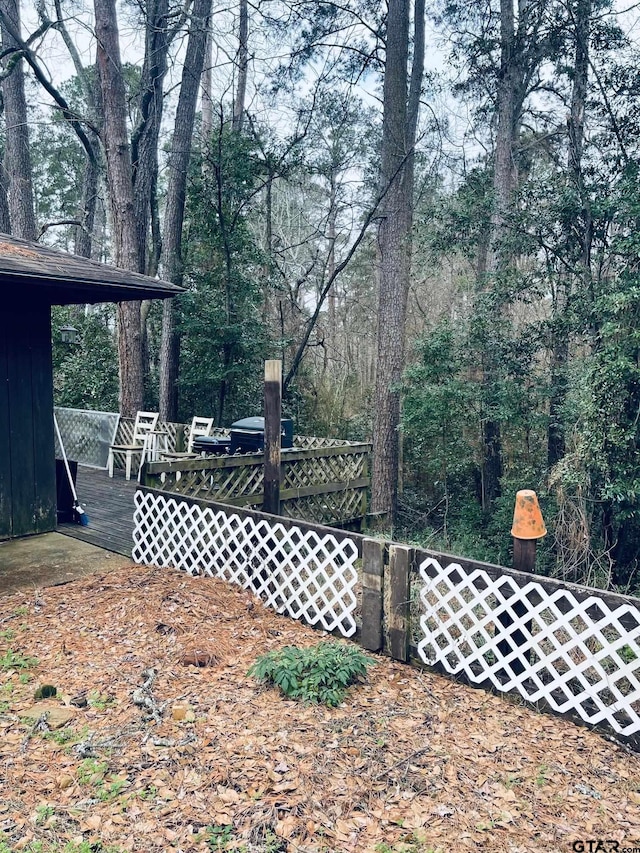 view of yard with a wooden deck