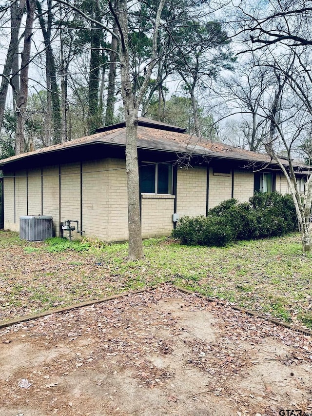 view of home's exterior featuring central AC