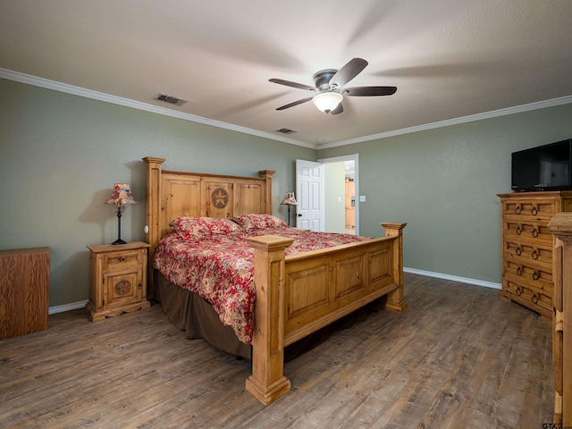 bedroom with ceiling fan, crown molding, and dark hardwood / wood-style flooring