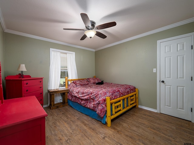 bedroom with dark wood-type flooring, ornamental molding, and ceiling fan