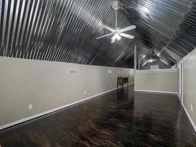 additional living space featuring ceiling fan, lofted ceiling, and dark hardwood / wood-style floors