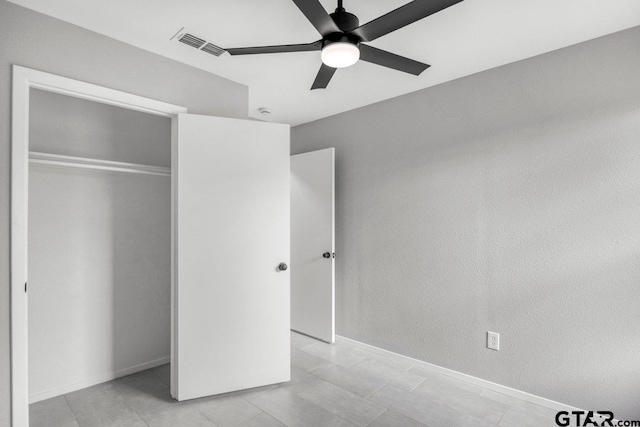 unfurnished bedroom with a ceiling fan, a closet, visible vents, and baseboards