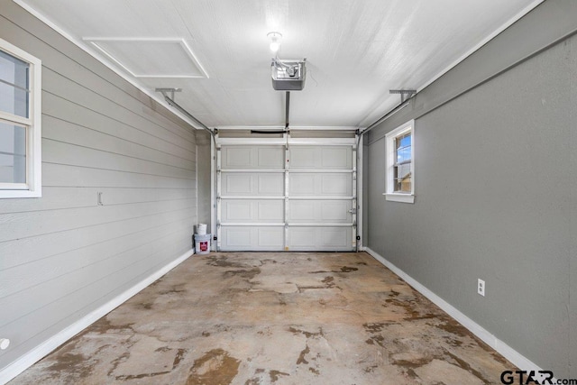 garage featuring baseboards and a garage door opener