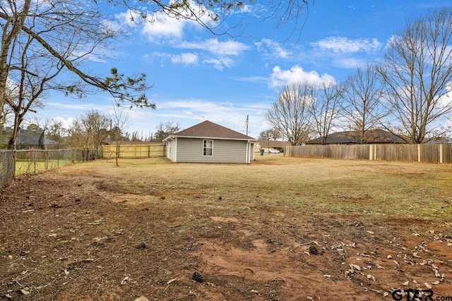 view of yard with a fenced backyard