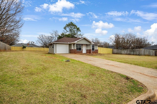 exterior space with driveway, an attached garage, fence, a yard, and brick siding