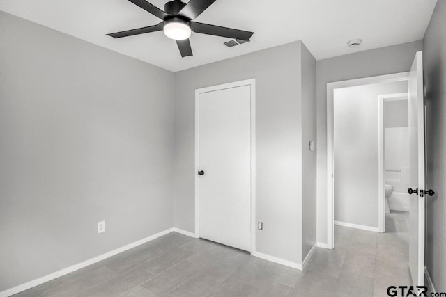 unfurnished bedroom with baseboards, a closet, visible vents, and a ceiling fan