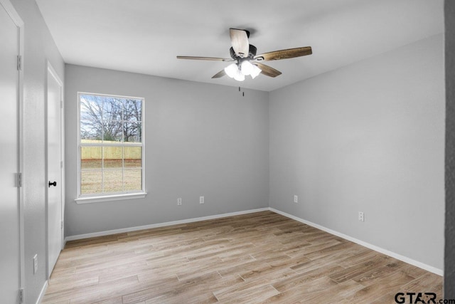 unfurnished bedroom with baseboards, ceiling fan, and light wood finished floors