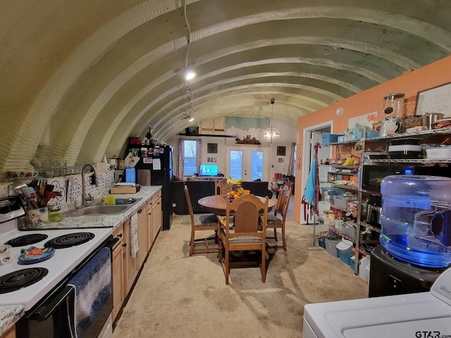 storage room with sink, french doors, and washer / dryer